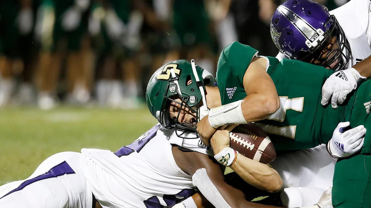 Cal Poly quarterback Jackson Pavitt (14) is sacked during the Mustangs’ 38-7 loss Weber State at Alex G. Spanos Stadium, Saturday, Oct. 2, 2021.