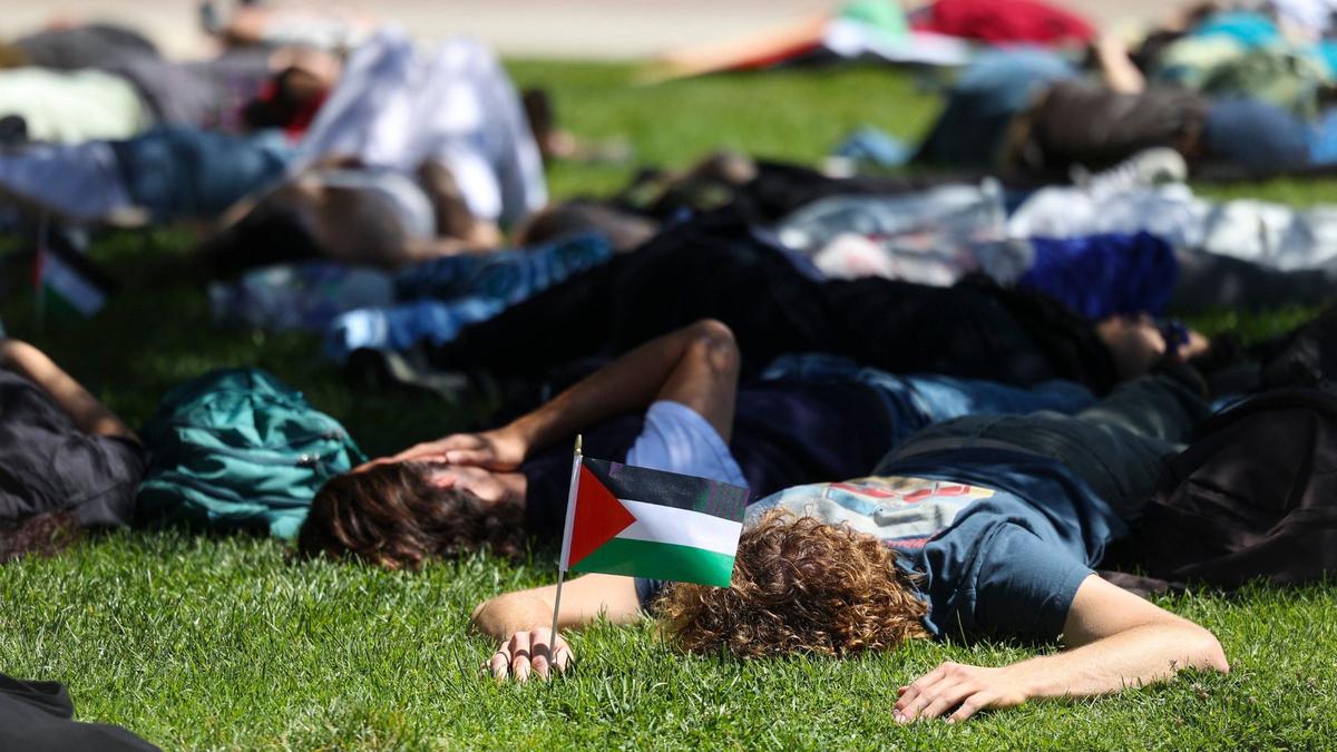 About 70 people gathered on Cal Poly’s Dexter Lawn on May 1, 2024, to stage a silent die-in in support of Palestine.
