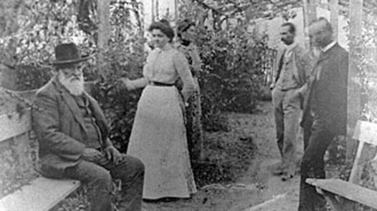 Pierre Hypolite Dallidet, left, sits in his garden in 1890