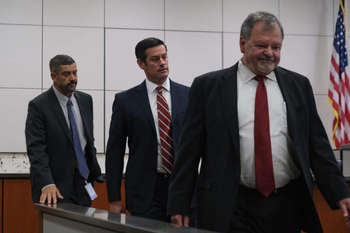 From left, San Luis Obispo County District Attorney’s Office investigator J.T. Camp, former San Luis Obispo County Deputy District Attorney Chris Peuvrelle and Paul Flores’ defense attorney Harold Mesick enter the courtroom to attend Flores’ restitution hearing. In October 2022, Flores was convicted of murdering Cal Poly freshman Kristin Smart. 