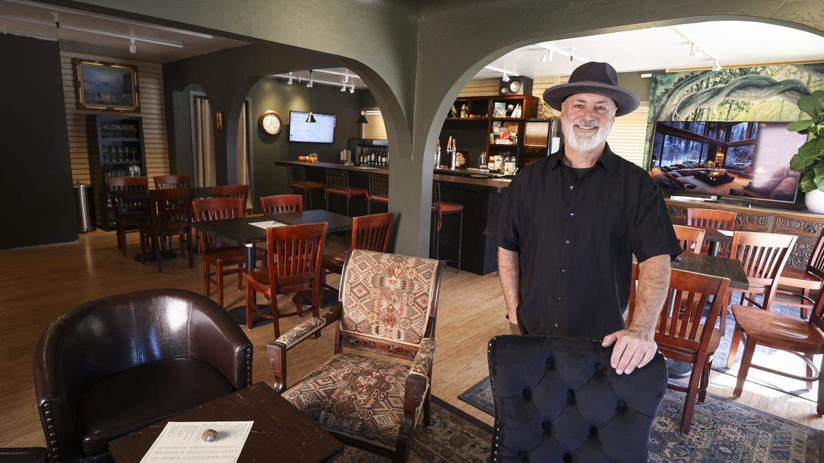 Optimyst co-owner Bob McCandless at the Cambria social club he and his wife own. It offers a variety of wine and beer and a cozy atmosphere on Burton Drive, seen here on Nov. 19, 2025.