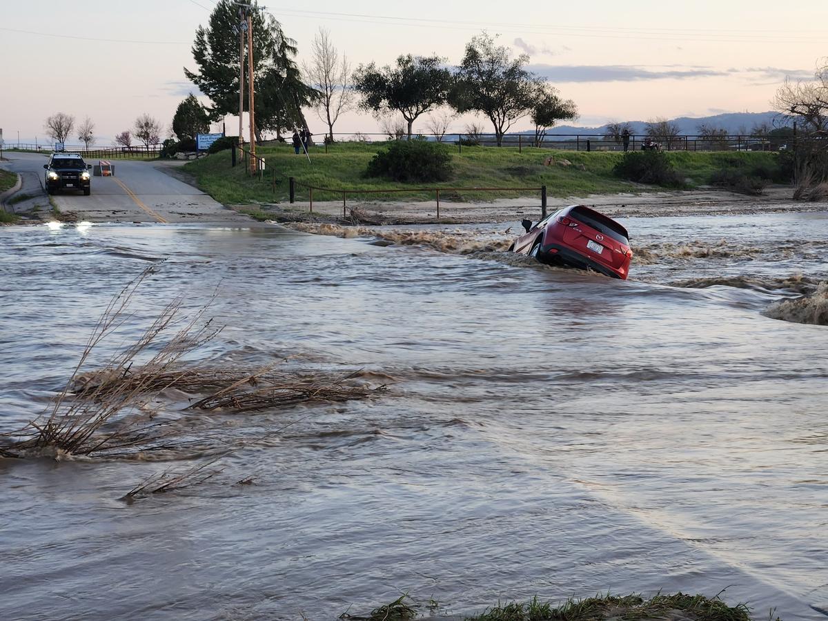 A mother and her three children were rescued in rural Paso Robles on Thursday, March 23, 2023, after floodwaters swept their car off North River Road and into the Estrella River.