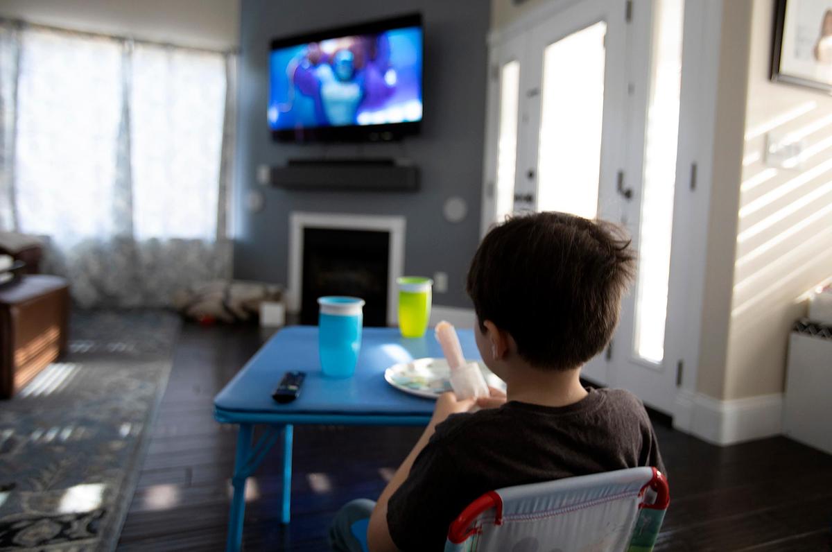 Tracy Dauterman’s son Brady eats a snack after school at home in Paso Robles. Dauterman vaccinated both Colton, 7, and Brady, 5, for COVID-19 shortly after it was approved for use in kids aged 5 to 11.