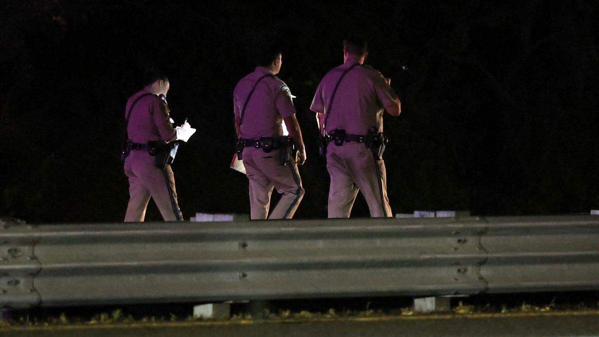 CHP walk the freeway investigating the scene. They were among the law enforcement who responded to an incident on Highway 101 at the Madonna Road overpass on Sept. 1, 2024.