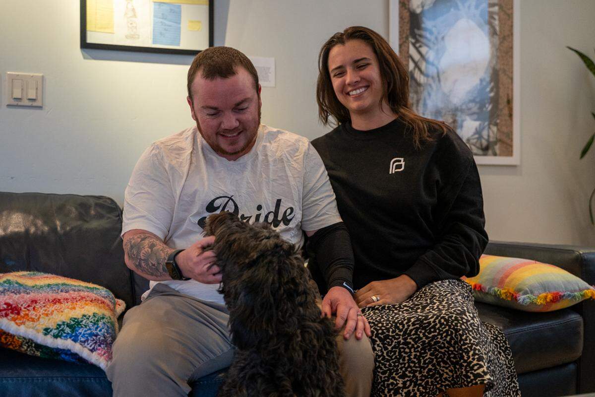 Tranz Central Coast chair Landon St. James and GALA Pride and Diversity Center program manager Linnea Valdivia and their dog pose for a photo at the GALA Pride and Diversity Center on Thursday, Feb. 5, 2026.