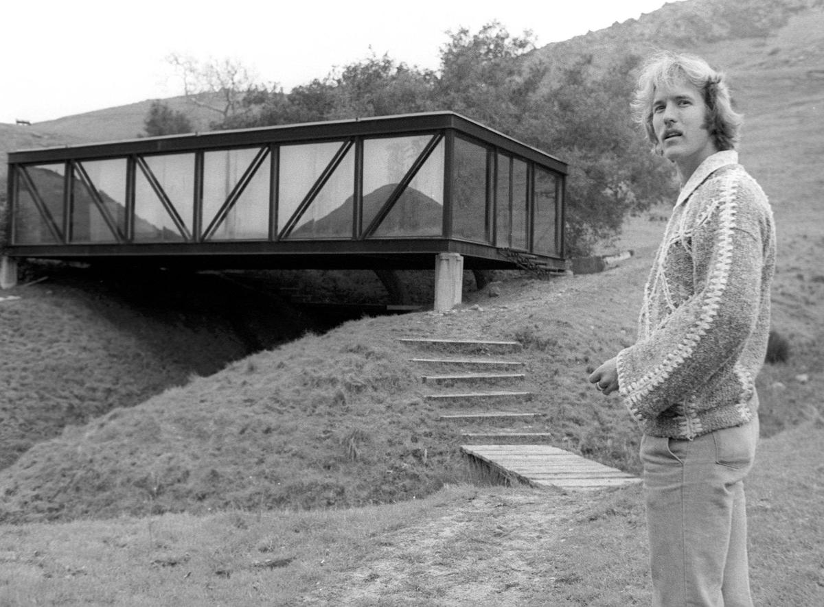 Poly Canyon resident Bill Maston looks toward the canyon from the steps leading to Bridge House on March 10,1980.