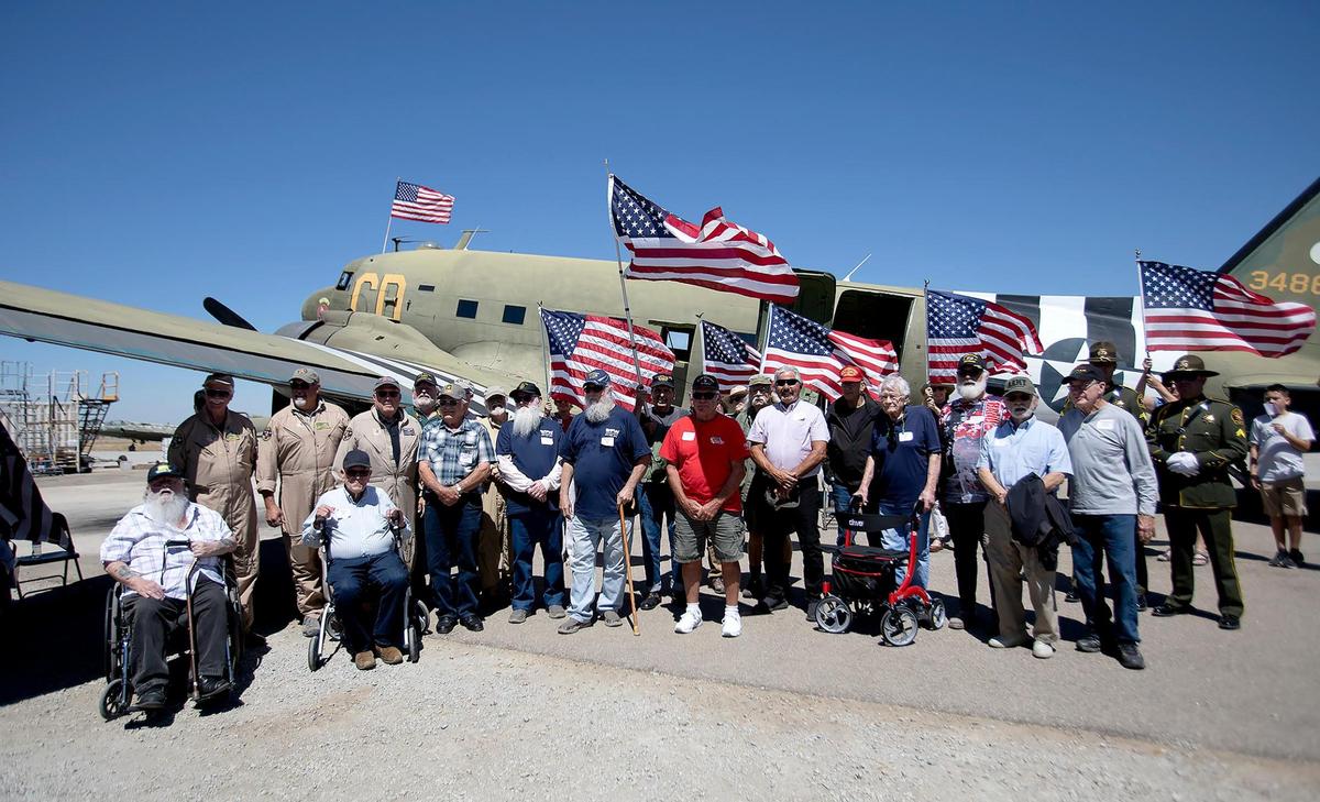 The 17 veterans and pilots gather for a photo next to the C-47 World War II plane Betsy’s Biscuit Bomber. The Honor Flight was held on Saturday, Aug. 28, 2022, from Paso Robles Municipal Airport to the coast.