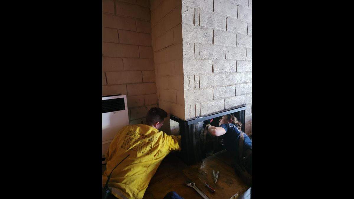 Cal Fire firefighters saved Zippy the cat from a Los Osos chimney using a can of tuna donated by High Street Deli Friday morning. Zippy is safe in his owners’ arms, Cal Fire said on Twitter.