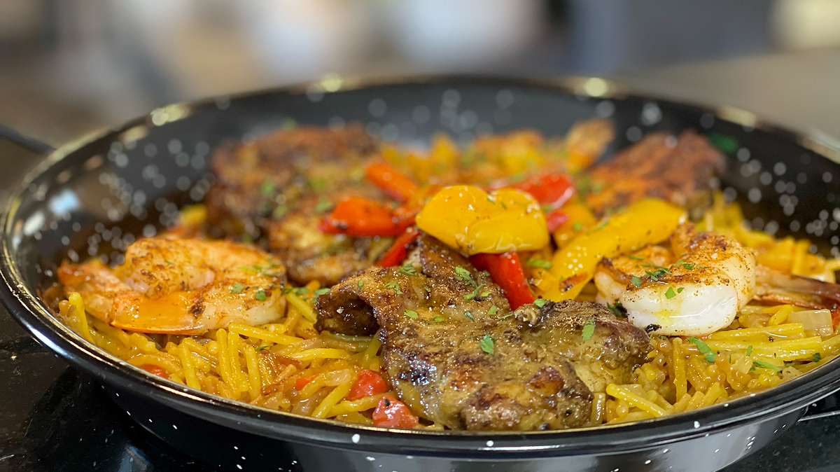 Fideua is a traditional pasta paella, made with roasted red peppers, grilled shrimp and chicken. It’s a favorite menu at Junction restaurant in Paso Robles.