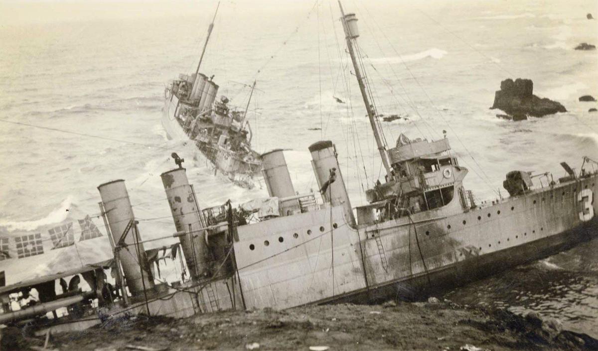 A sailor dangles from a rescue line in front of the USS S.P. Lee with the USS Nicholas in the background after seven U.S. Navy destroyers ran aground at Honda Point north of Point Conception in heavy fog on Sept. 8, 1923. It was the worst peace-time Navy disaster with the death of 23 seamen and the loss of the destroyers.