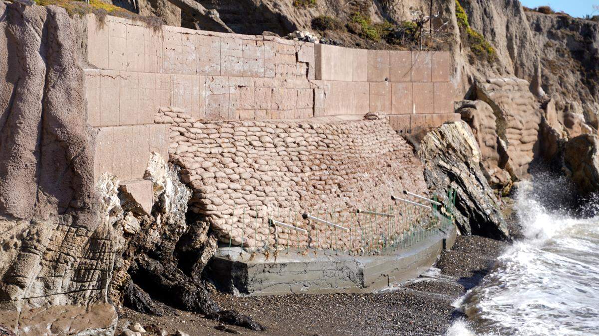 A stretch of seawall near 195 Seacliff Drive is in the process of being repaired in Shell Beach. A large crane was spotted moving materials between the blufftop street and the beach earlier this week.