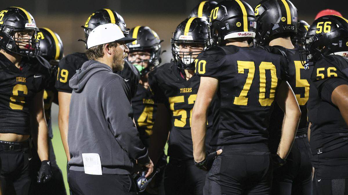 Pat Johnston talks to players about focus after he had to call time out to prevent a delay of game penalty. San Luis Obispo beat Nipomo 22-16 on Sept. 12, 2025.