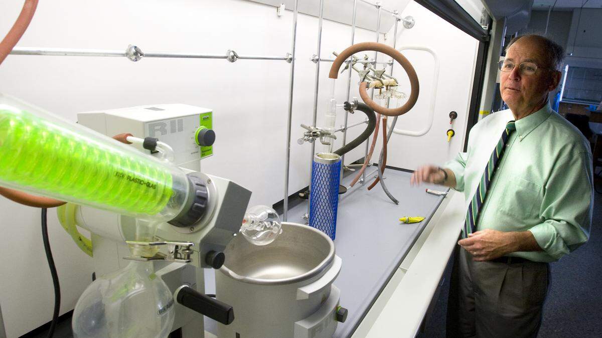 Dr. Phil Bailey, dean of the College of Science and Mathematics, shows off an energy-efficient exhaust hood inside Cal Poly's Warren J. Baker Center for Science and Mathematics.