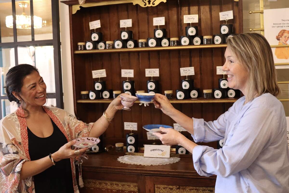 The Tea Trolley is reopening in Atascadero under new ownership, but the same name, on Friday, Sept. 26, 2025. Gina Hammond, the shop’s tea curator, right, shares a cup of tea with store owner Deneen DiCarlo in front of their selection of teas.