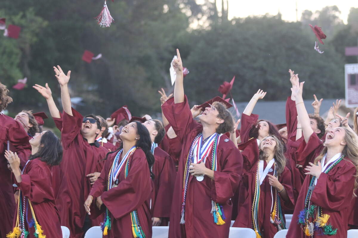 Paso Robles High School seniors toss their caps after turning their tassels at commencement on June 5, 2026. Around 414 students graduated.
