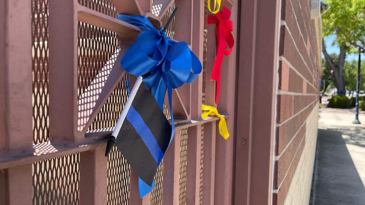 Members of the PRotect Paso Facebook group decorated the Paso Robles Public Safety Center with flags and ribbons, including a “thin blue line” flag that was removed by Chief Ty Lewis.