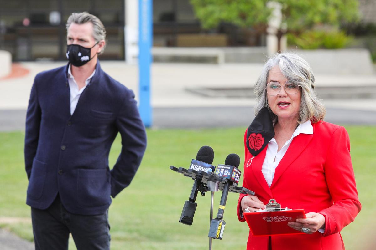 San Luis Obispo Mayor Heidi Harmon speaks during California Gov. Gavin Newsom’s visit to the vaccination site at Cuesta College.