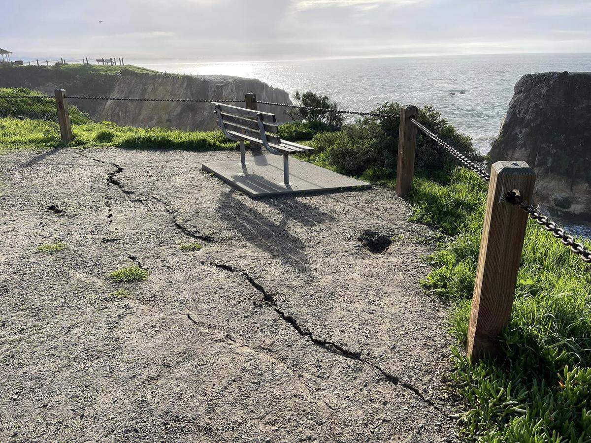 Large cracks in the ground of a cliffside at Margo Dodd Park in Pismo Beach.
