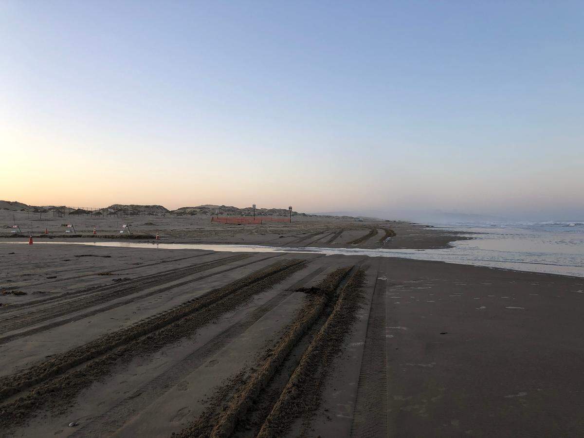 Tire tracks cut through the sand at Arroyo Grande Creek at Oceano Dunes State Vehicular Recreation Area on Tuesday, March 23, 2021. Crossing the creek while water flows to the ocean is banned under new restrictions on California State Parks’ coastal development permit for the park.