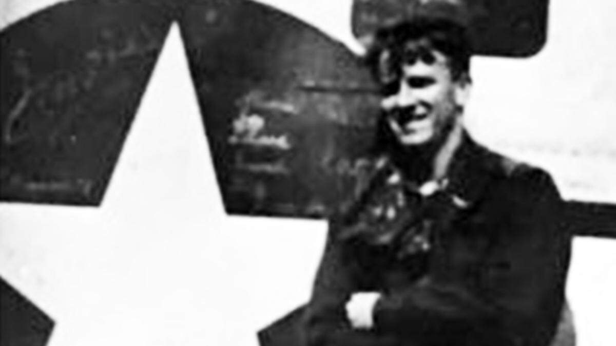 Sgt. Albert Lee Findley with his B-24, taken in 1944.