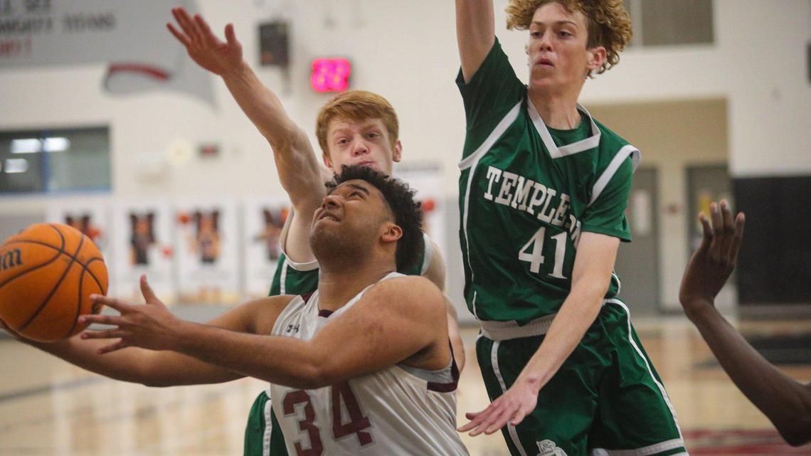 R.J. Blackmon scoops a shot past Luke Cherry (33) and Ryan McNamee (410 in Nipomo’s 65-56 win over Templeton in a boys playoff basketball game on Feb. 17, 2023.