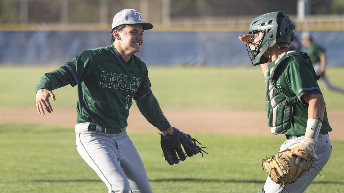 Nate Argain celebrates a complete game victory with catcher Luke Stetz. Templeton beat Morro Bay 2-0 on May 15, 2026 in the Division III 2026 CIF Central Section Baseball Championship playoff.