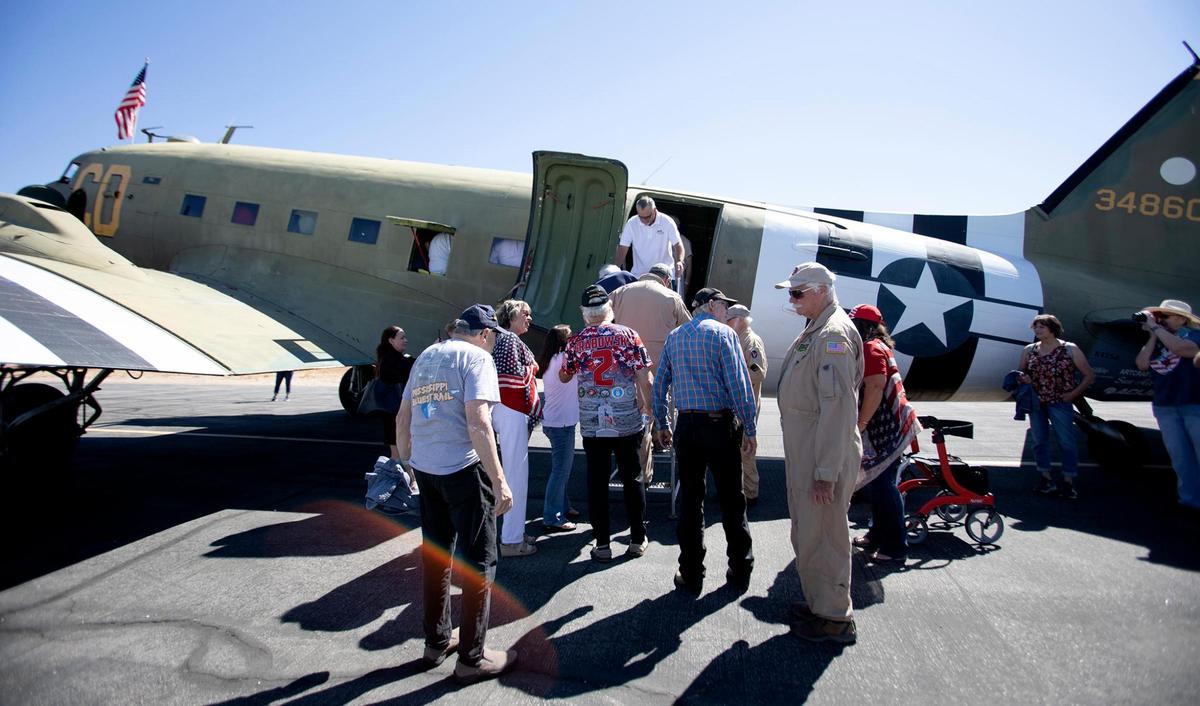 Veterans load on the C-47 Betsy’s Biscuit Bomber for a special Honor Flight from Paso Robles to the coast on Saturday, Aug. 28, 2022.