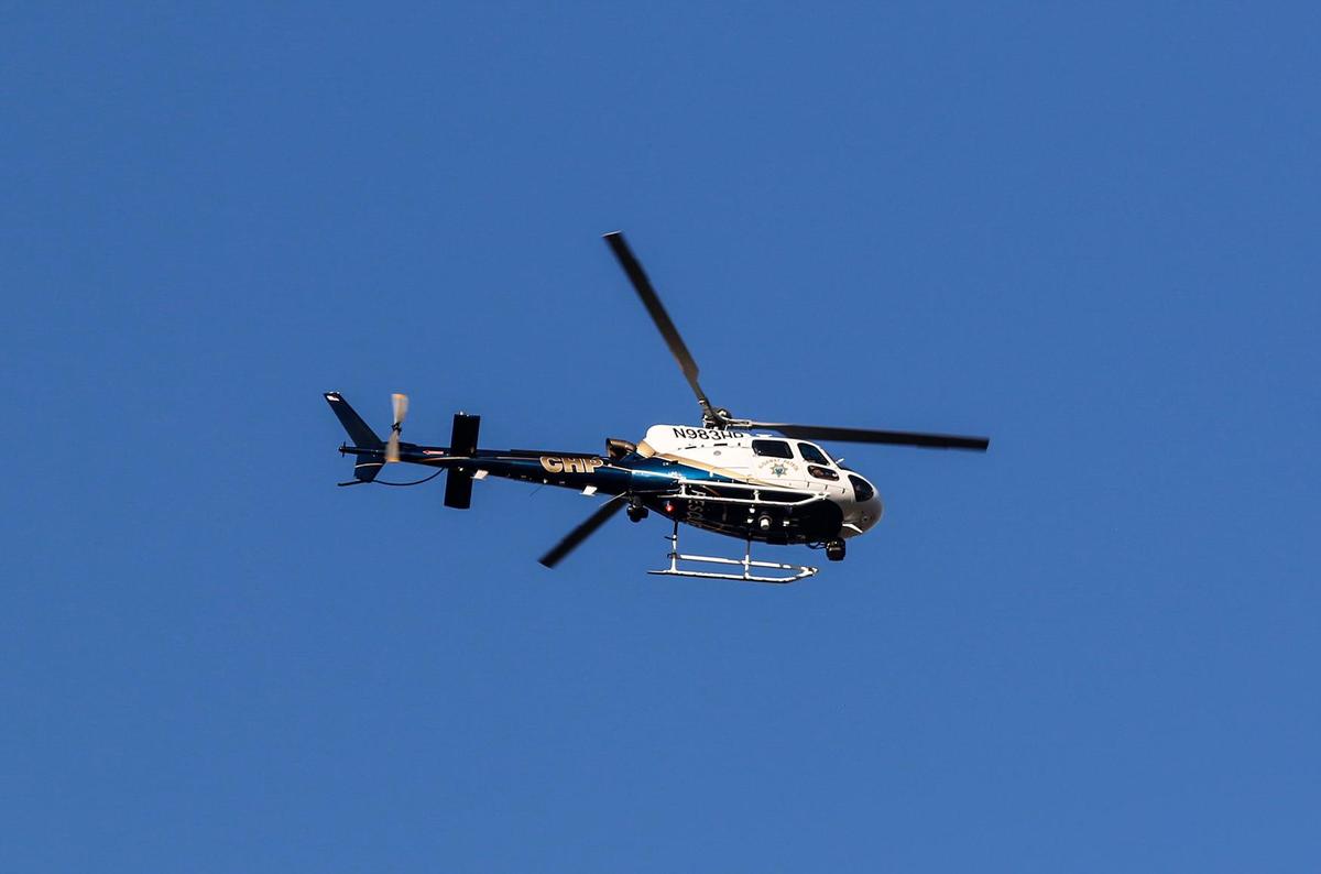 The San Luis Obispo Police Department posted on social media that a man believed to be a suspect in shootings at both a Grover Beach 7-11 and a San Luis Obispo Panda Express was in custody as of Thursday evening. The CHP helicopter H-70 was hovering over the scene.