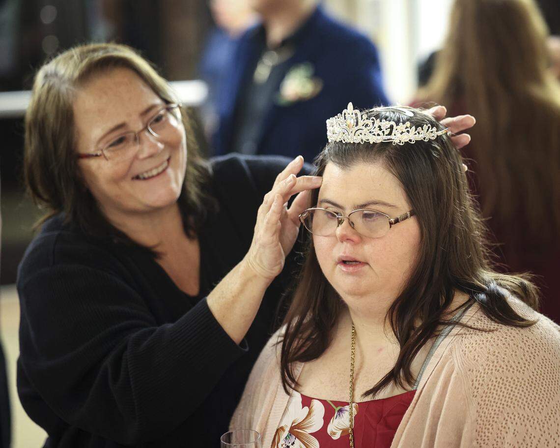 Rhonda Toole places a crown on daughter Taylor’s head. The Let Your Light Shine Special Education Prom was held at Atascadero Lake Park Pavilion on Jan. 23, 2026. It was for special needs individuals from the county, their friends and family.