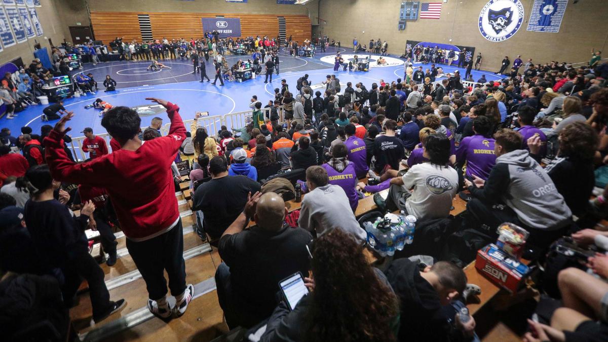 Fans and athletes watch the wrestling competition on seven mats in Morro Bay High School’s main gym. Over 900 wrestlers from across California came to Morro Bay to attend the California Invitational Tournament on Jan. 19, 2024.