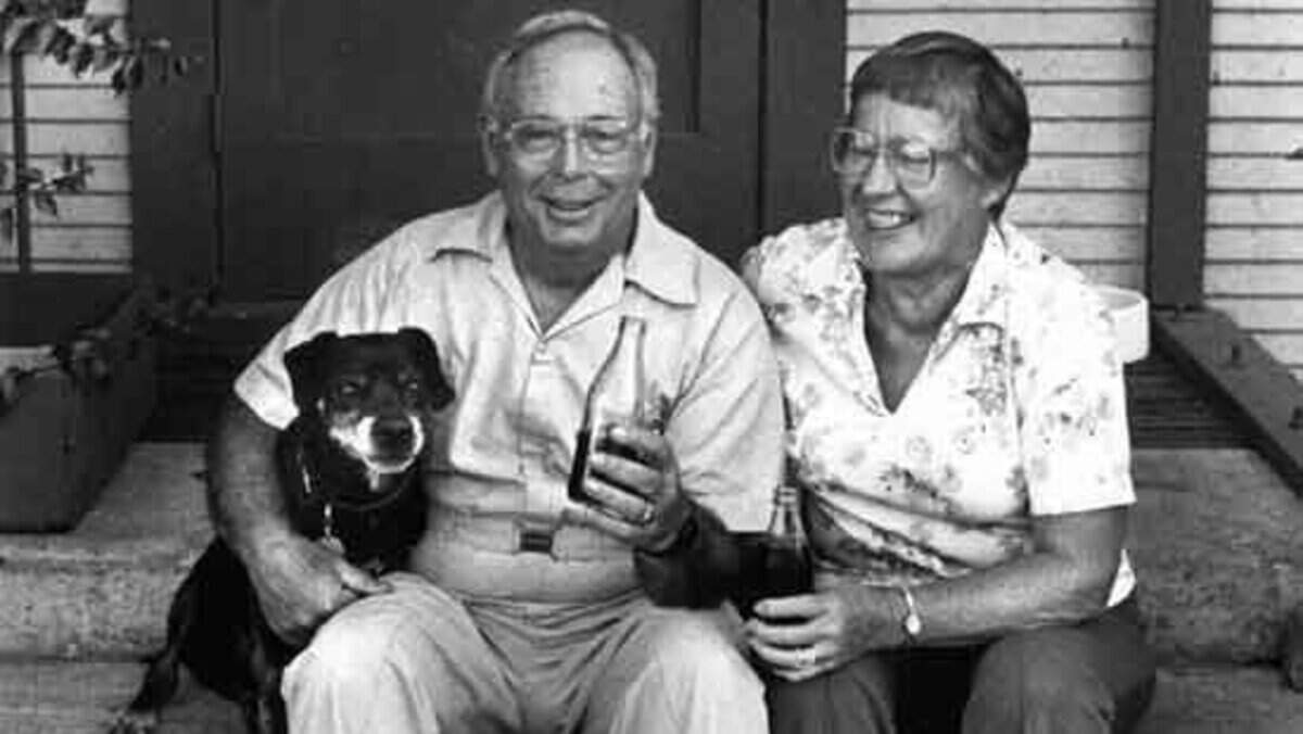 Wilmar and Henrietta Tognazzini with dog Stud sipping bottles of homemade root beer, from a story published November 13, 1987.