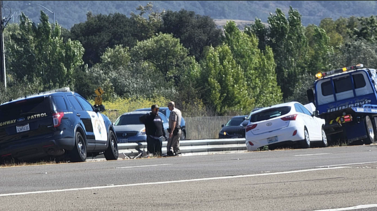 California Highway Patrol vehicles surround two vehicles involved in a collision at 3:20 p.m.
