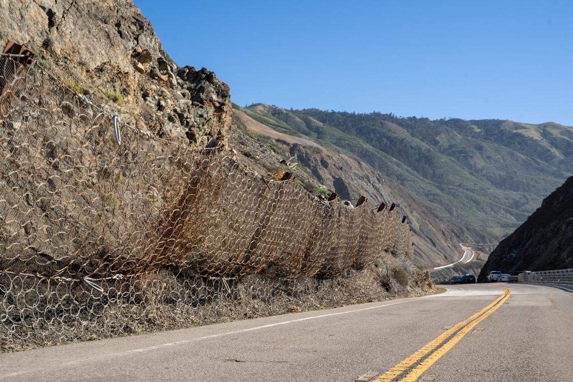 Netting holds back loose debris just north of Regent's Slide on Wednesday, Jan. 14, 2026. Highway 1 was closed for three years due to a pair of large landslides starting in January 2023.