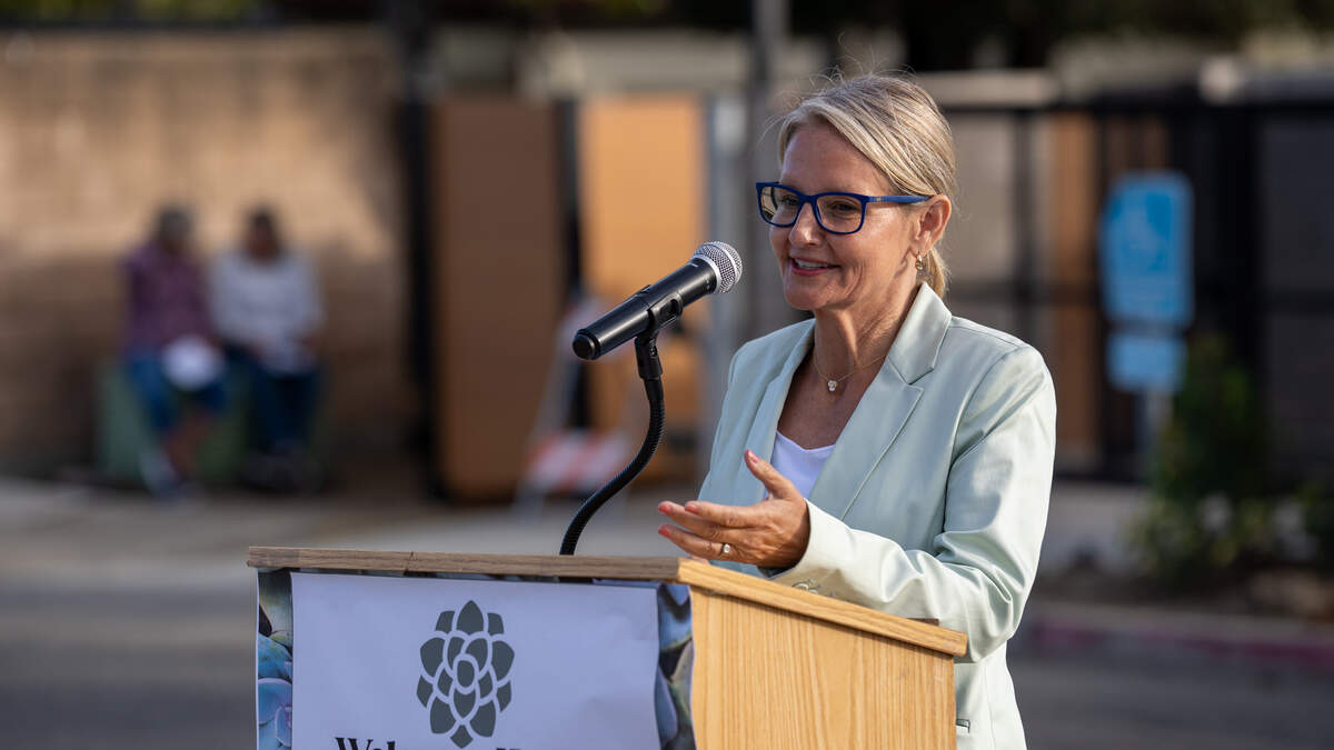 Project manager Margaret Shepard-Moore speaks during the grand opening of the Welcome Home Village project on Monday, June 8, 2026. The project consists of 40 3D-printed permanent supportive housing units and 14 interim supportive housing units with wraparound supportive services onsite.