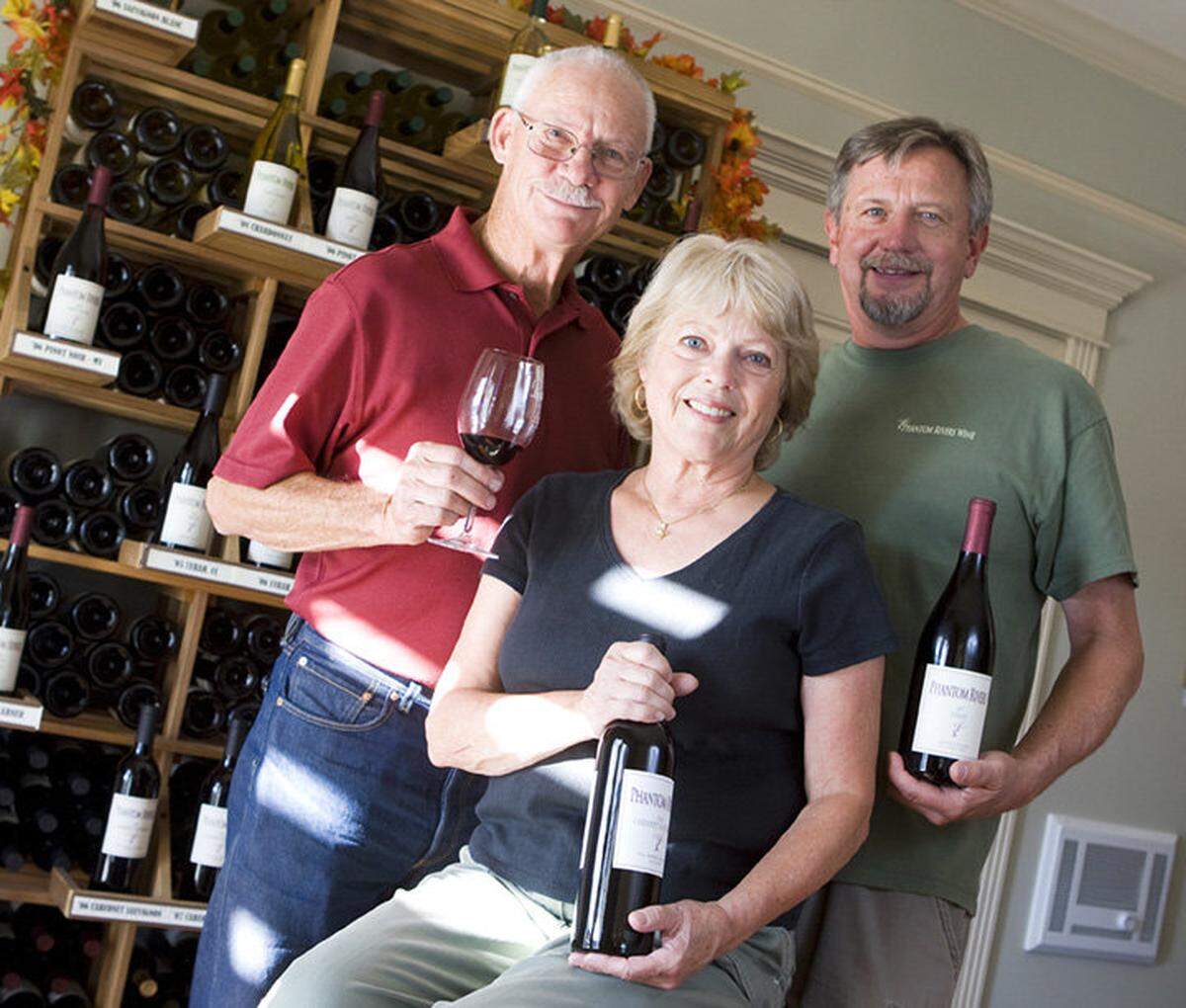 John Thunen, in red, his wife Linda and Steve Mathis at their Phantom Rivers Tasting Room in the Arroyo Grande village soon after it opened in 2009.