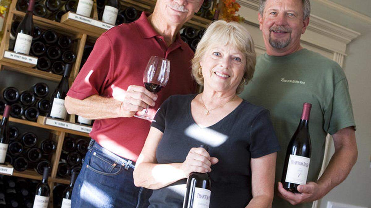 John Thunen, red, his wife Linda and Steve Mathis at their Phantom Rivers Tasting Room in the Arroyo Grande village soon after it opened in 2009.
