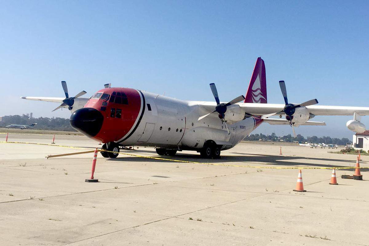 A C-130 that crash landed at the Santa Barbara Airport on Aug. 25 remains parked near a hangar on north side of the airport.