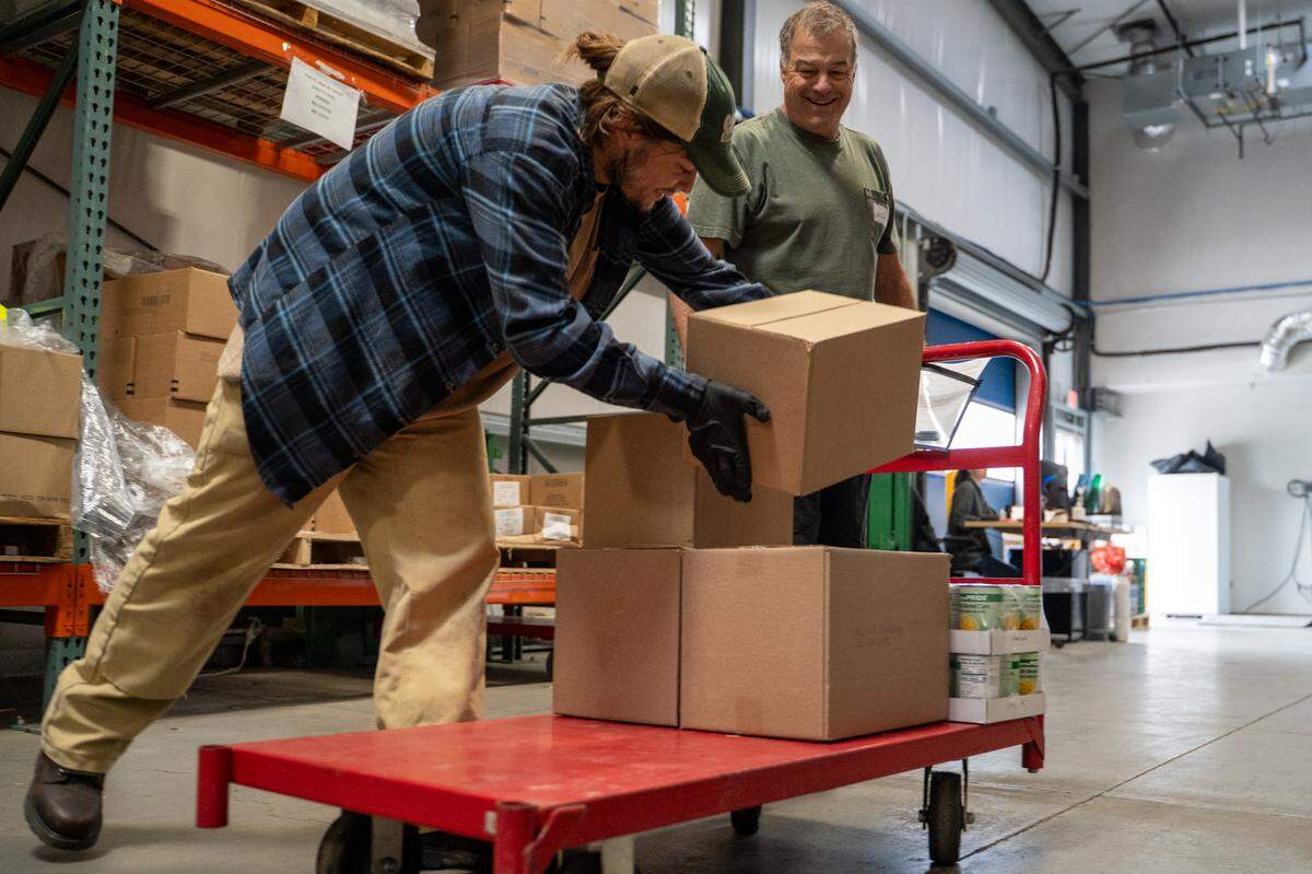 Volunteers load food donations at the SLO Food Bank on Friday, May 1, 2026. The SLO Food Bank is one of many food insecurity organizations that are facing CalFood funding cuts in this year's state budget.
