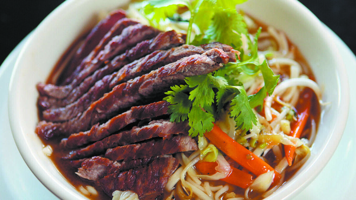 Mee Heng Low offers three basic noodle dishes, which are customized with proteins and sauces. Shown here is the beef low mein with sweet plum sauce.