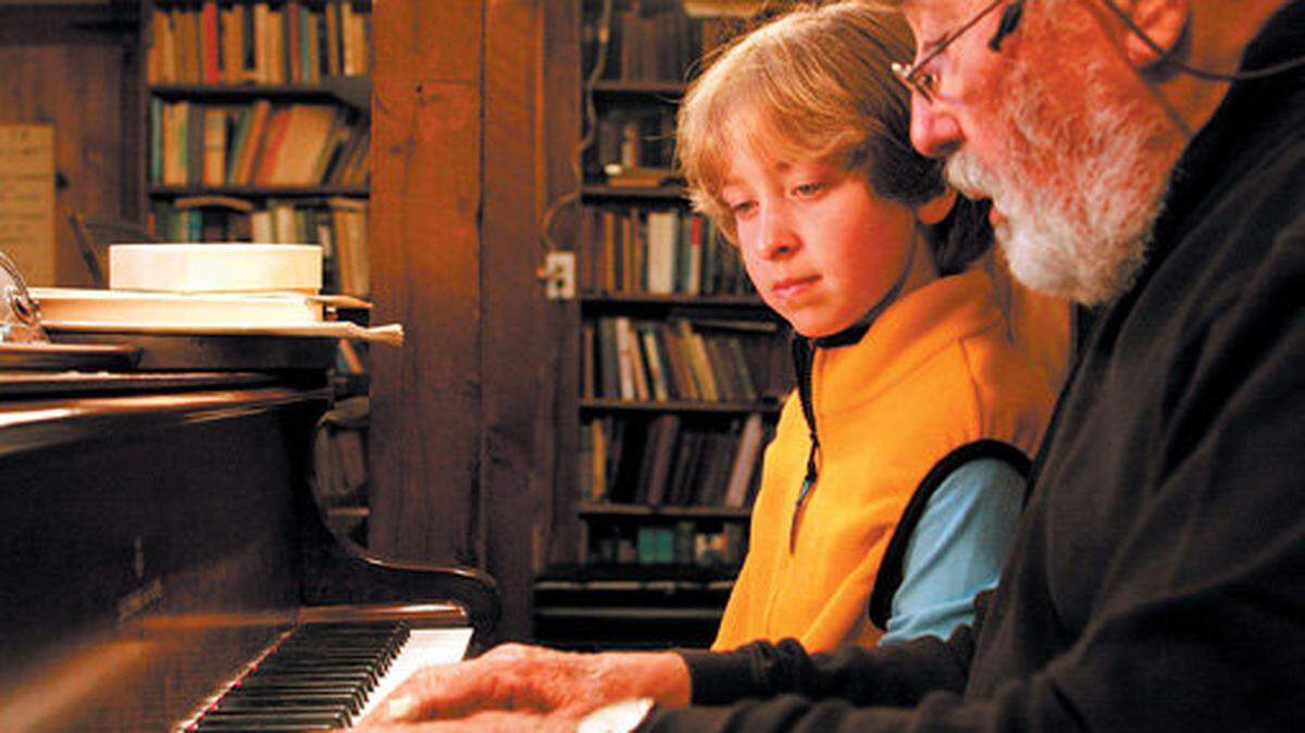 In this 2007 photo, "Botso" Korisheli gives a piano lesson to student Madeline Ogle, 10, at his home in Morro Bay.