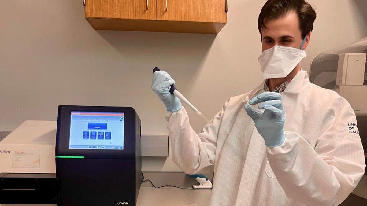 UC Santa Barbara graduate student Zach Aralis uses equipment to sequence novel coronavirus samples as part of a research project to track virus variants in Santa Barbara County.