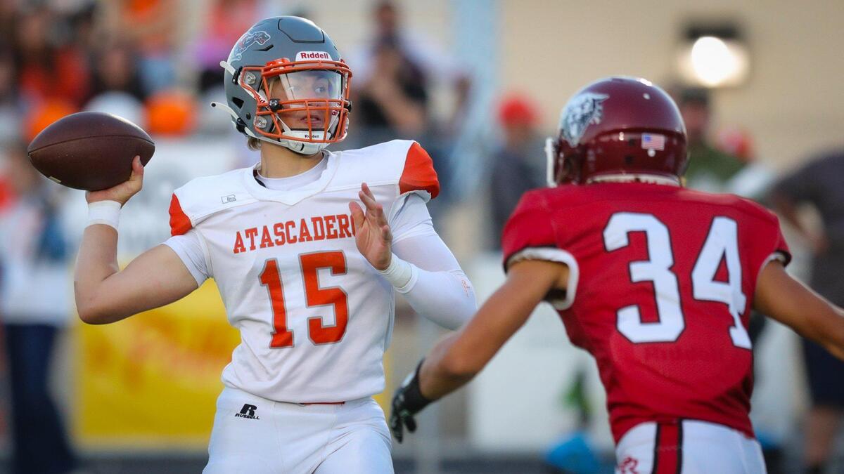 Kane Cooks throws under pressure from Willis Mathias. Atascadero beat Paso Robles 28-14 at War Memorial Stadium in the teams annual rivaly football game on Sept. 1, 2023.
