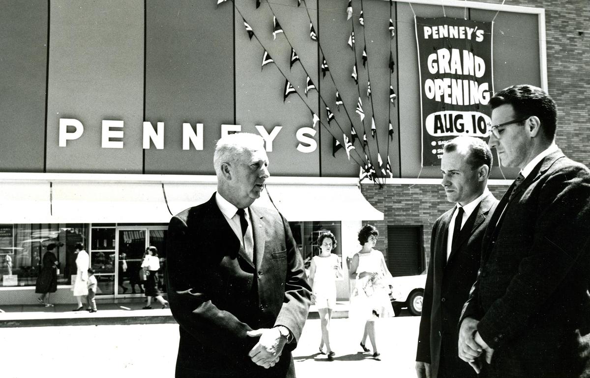 Standing opposite the new Monterey street entrance to the enlarged and remodeled J.C. Penney company store are, from left, manager John F. Groene, assistant manager Thomas Savage and department manager Charles Bove on the eve of grand re-opening on Aug. 9, 1961.