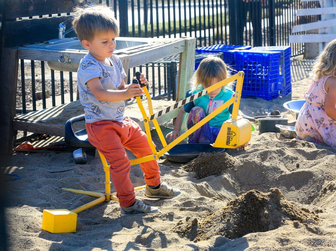 Calvin Carlisle, almost 3, digs in the sand. Trust Automation runs a child care center for its San Luis Obispo employees that cares for infants up to 4 years old. The program is in high demand.
