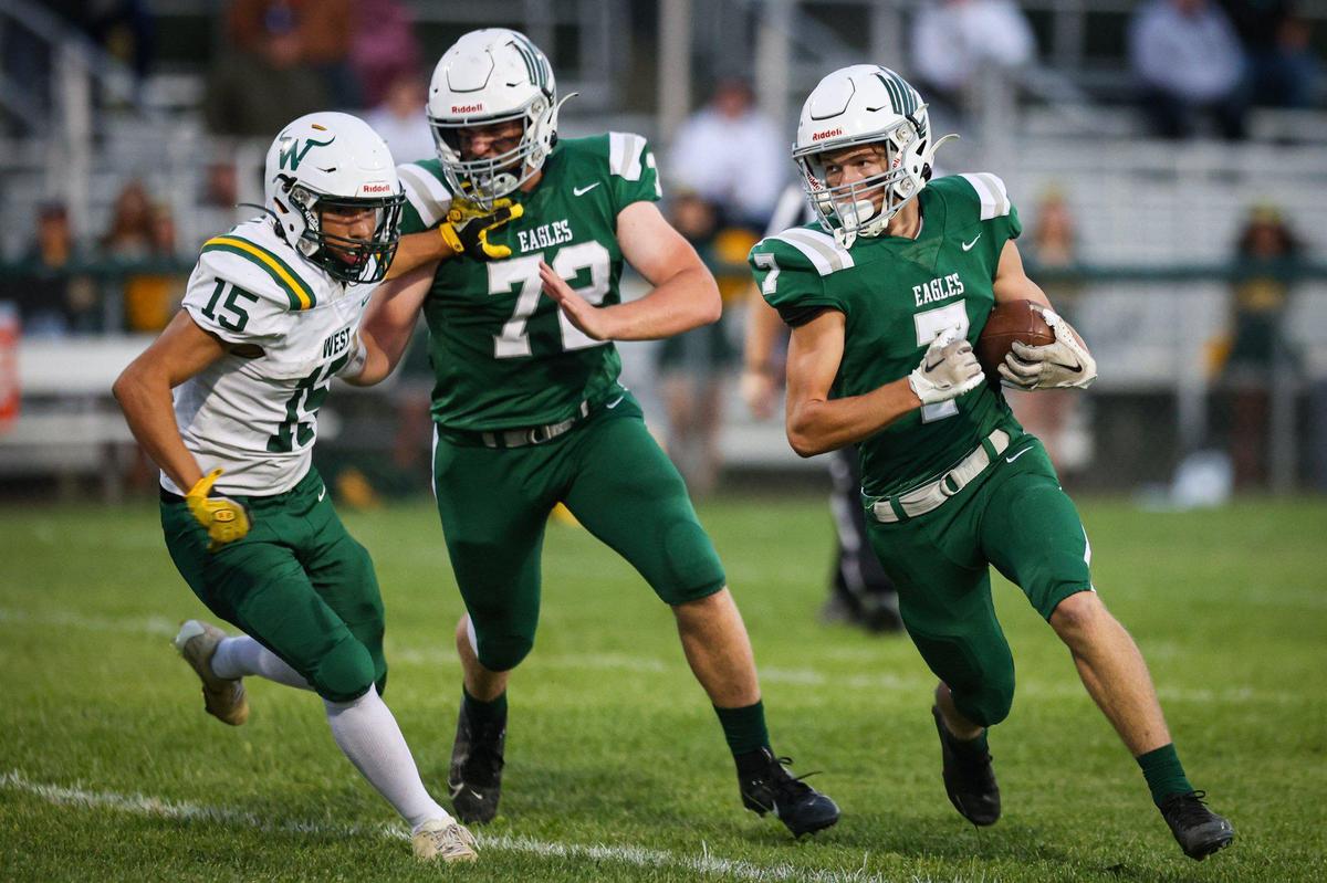 River Waltmire turns the corner for a touchdown, blocking is Aiden Wall on Guy Vasquez. Templeton won 42-0 over West (Bakersfield) in a high school football game Sept. 15, 2023.