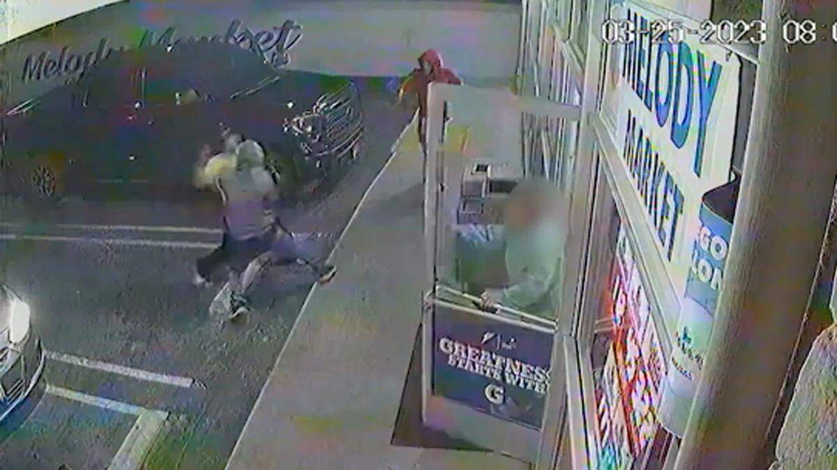 A screen capture from a surveillance video shows the altercation that led to a fatal officer-involved shooting at the Melody Market in Orcutt.