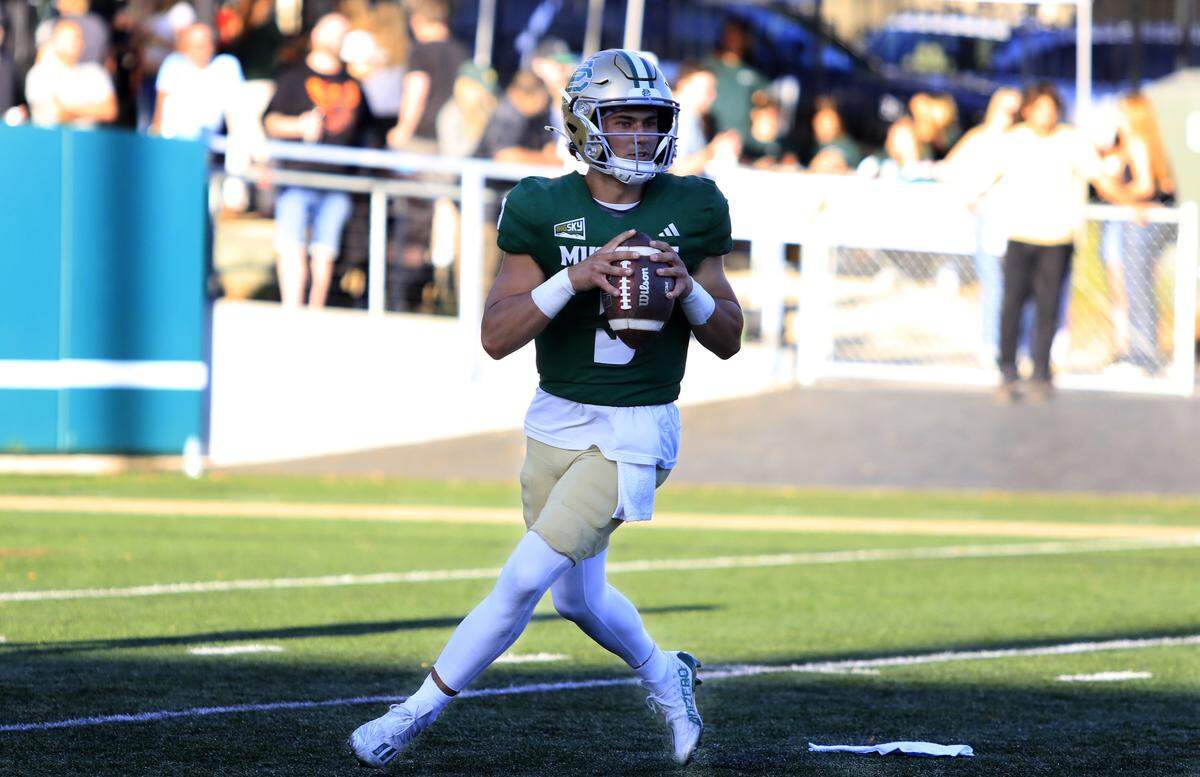 Mustang quarterback Bo Kelly looks for a receiver. Cal Poly lost to UC Davis 34-27 in a college football game at Mustang Memorial Stadium on Oct. 4, 2025.