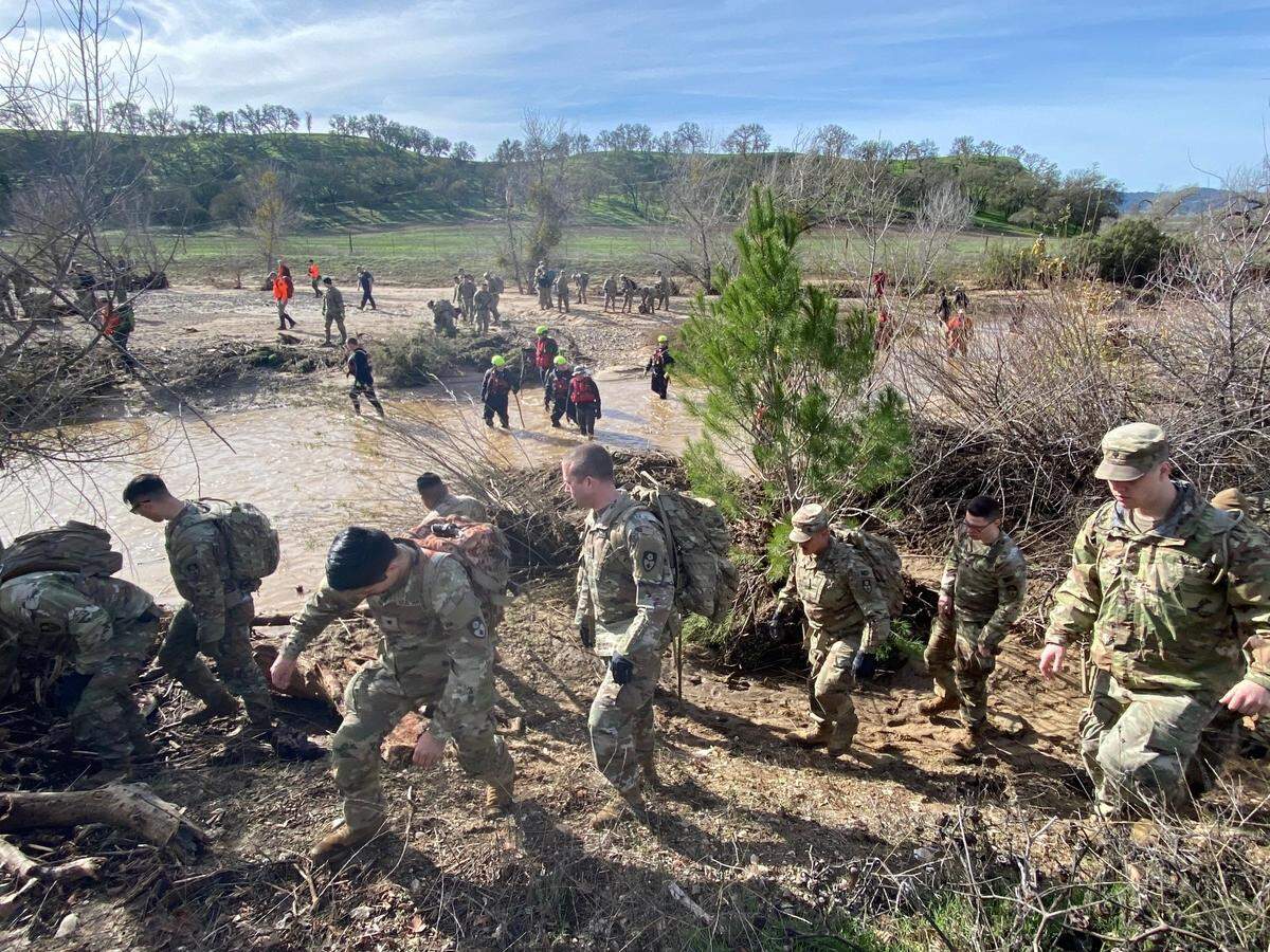 Search teams look for missing 5-year-old Kyle Doan, who went missing Jan. 9 near San Miguel when he was carried away by floodwaters. Doan has not been found after three days of searching.