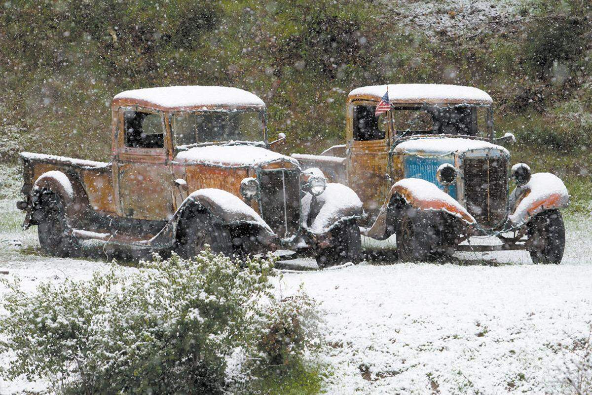 Snows falls on old trucks on the side of Hwy. 41 west from Atascadero on Feb. 9, 2009.