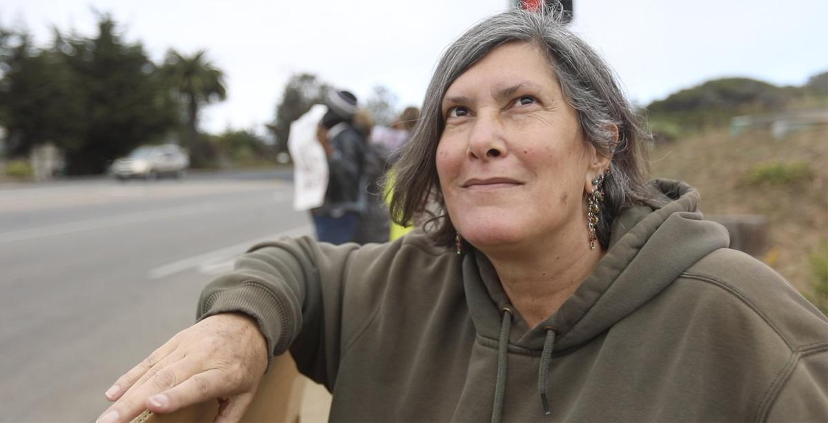 Debbie Gedayloo began what has become a regular Los Osos event. Every Tuesday opponents of Donald Trump gather in the evening at the corner of South Bay Boulevard and Los Osos Valley Road.